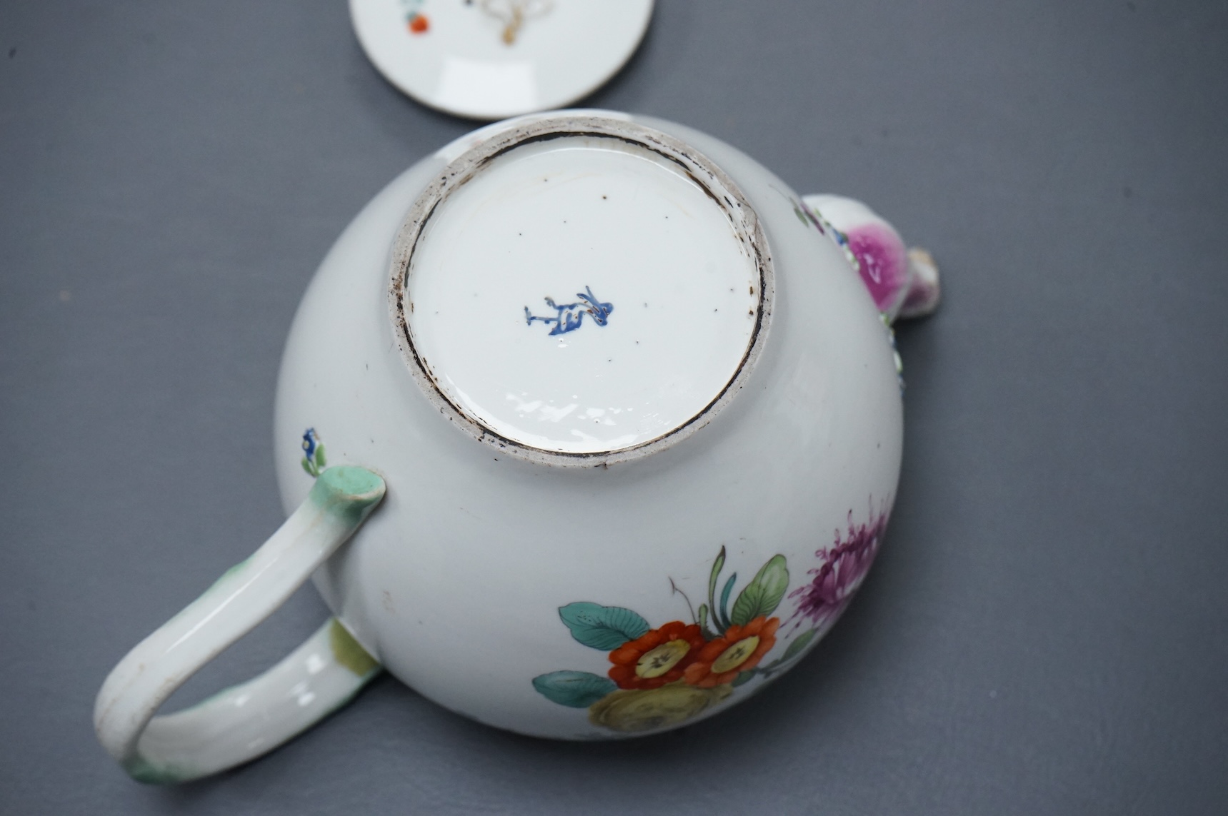 The Hague, a late 18th century soft paste porcelain teapot, painted with polychrome flowers, 12cm high